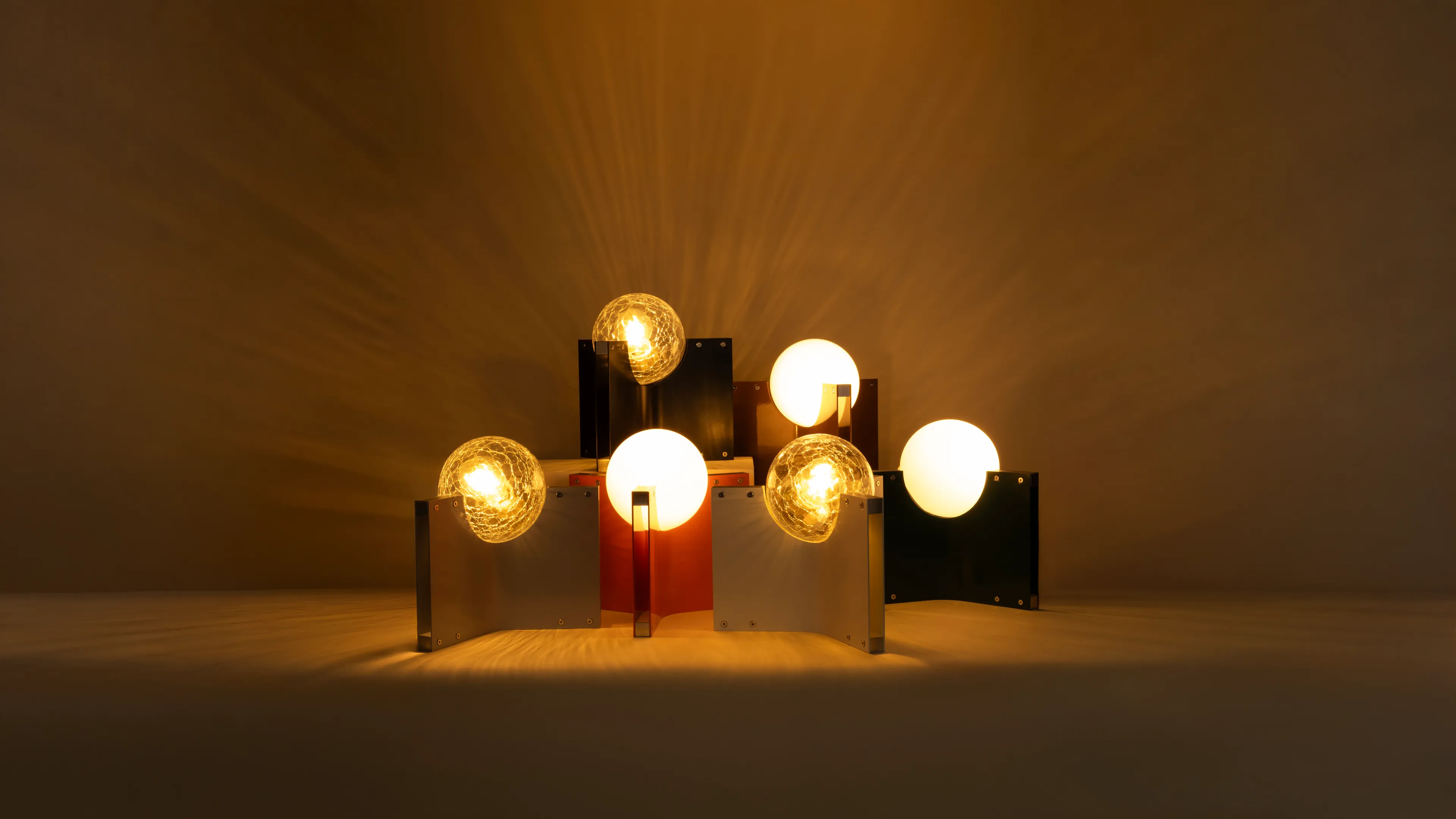 The Crackdown Mini family, lit, in crackle and opal glass across the colour range